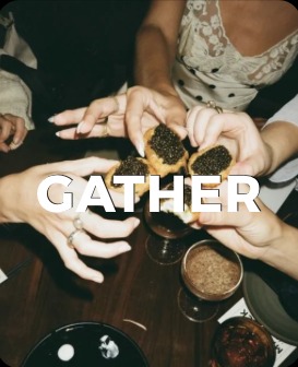 Hands reaching over a shared table