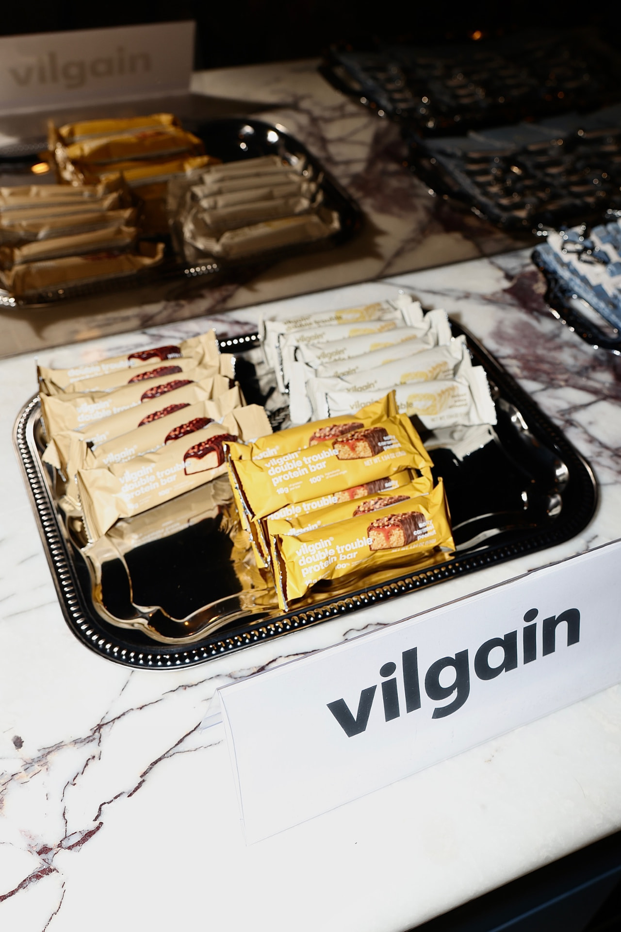 Vilgain protein bars served on silver trays at an AT THE SET gathering