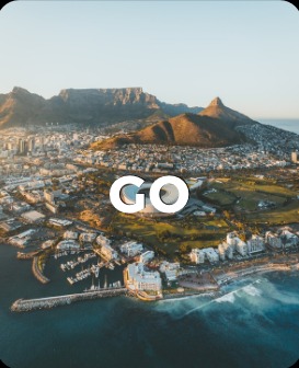 Aerial view of a coastal city and mountain