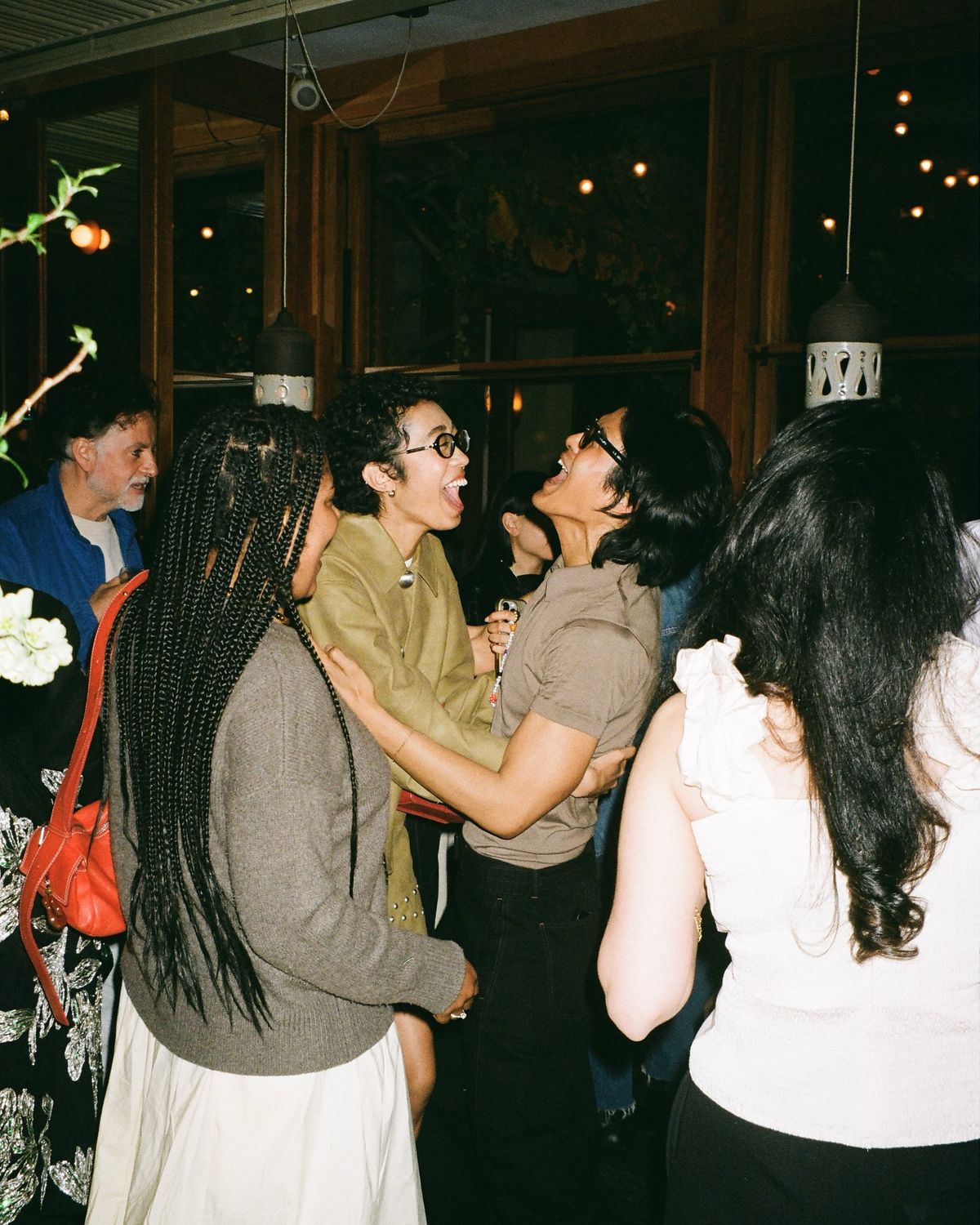 Guests laughing and gathering at an AT THE SET evening